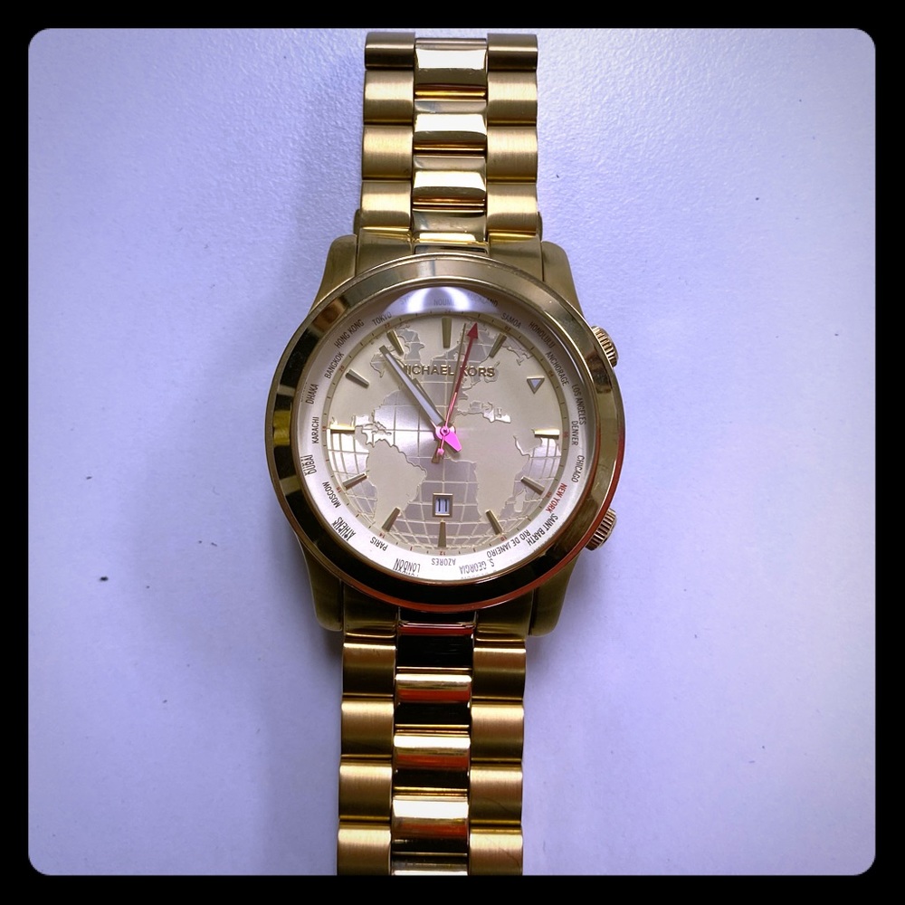 Gold MK world watch.